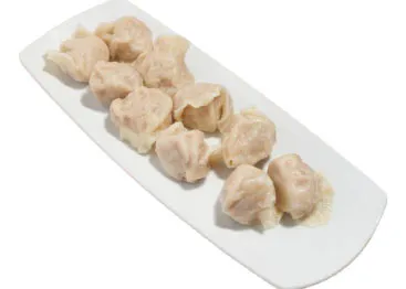 Boiled dumplings with juicy filling, served in a white bowl at Nanjing Diner